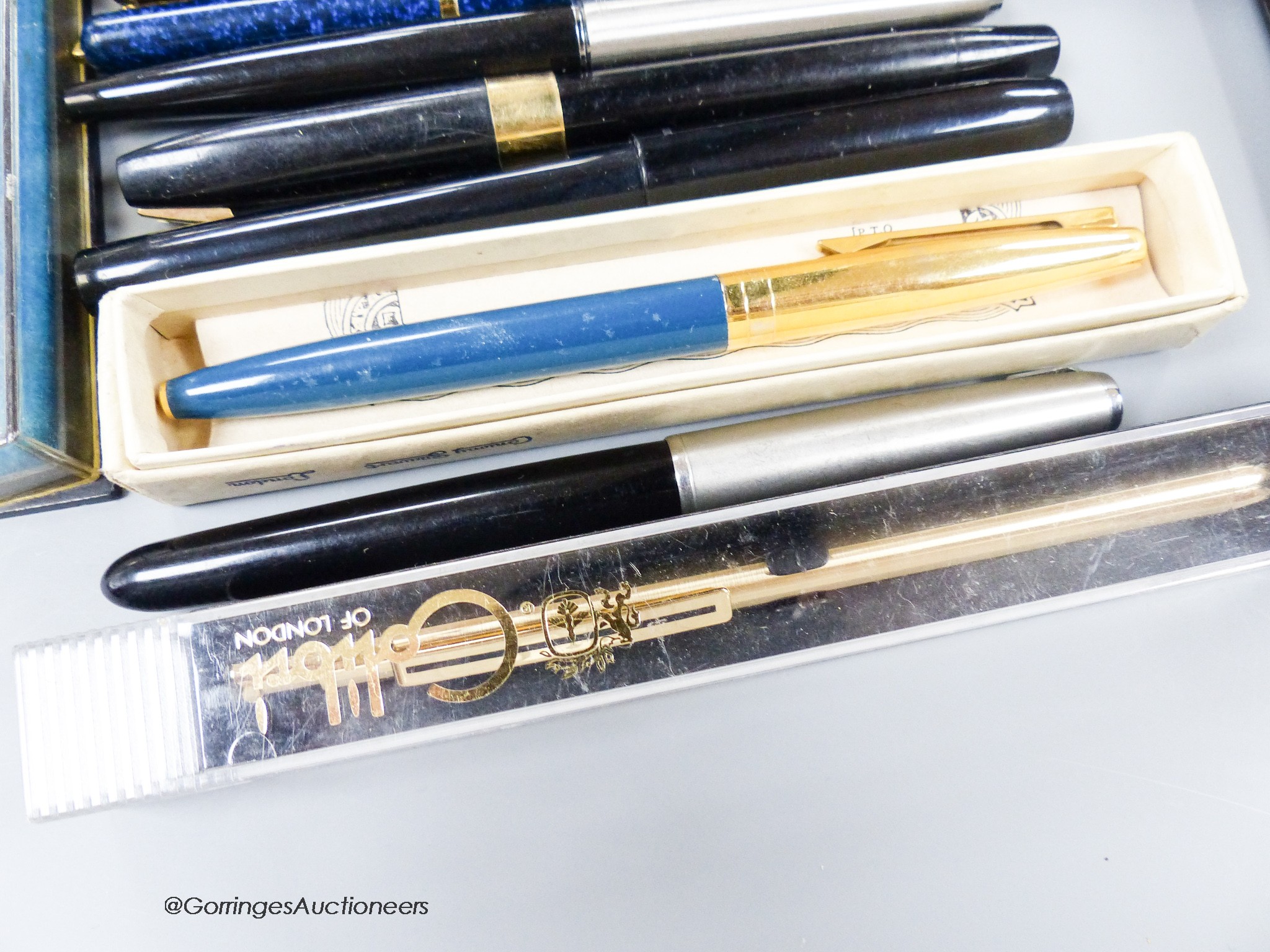 An assortment of fountain pens and ball point pens